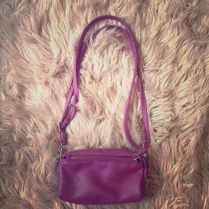 A purple crossbody kids bag